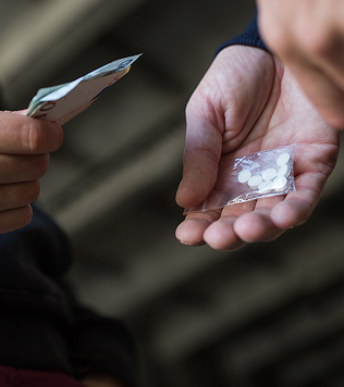 close up of addict buying dose from drug dealer 1